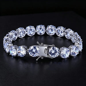 10mm silver iced out sparkle tennis bracelet with heavy‑duty double lock safety clasp, front studio shot on deep black background, large round prong‑set VVS simulated diamond stones with subtle cool blue hue, silver plated unisex hip hop bling wrist jewelry for men and women, RDRIP JEWELRY
