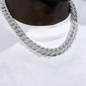 15mm 5-Row Fully Paved Iced Cuban Link Necklace in silver tone for men, fully encrusted VVS clear moissanite stones thick miami curb chain, full pave icy hip hop choker displayed on dark black skin mannequin neck with plain white cotton t-shirt, shiny silver bling rapper streetwear statement jewelry, heavy solid fully diamond paved cuban chain, sparkling lab diamond encrusted curb link necklace for hip hop fashion lovers, trendy mens icy street accessory, premium iced out silver cuban link neck chain for ev