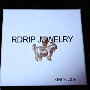 29mm Full Micro Paved Iced‑Out GOAT Pendant laid flat on official RDRIP JEWELRY branded gift box, fully micro paved VVS simulated diamond goat hip hop charm, top down overhead shot of premium street culture jewelry, RDRIP JEWELRY SINCE 2016