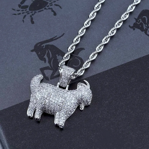 29mm Full Micro Paved Iced‑Out GOAT Pendant silver tone angled lifestyle shot, fully micro paved VVS simulated diamond goat charm with silver rope chain, laid on dark textured surface, real‑life styling photo for icy hip hop streetwear rapper jewelry, RDRIP JEWELRY SINCE 2016