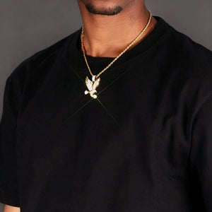 33mm Iced Victory Eagle Pendant gold plated cubic zirconia eagle necklace with sparkle light effect worn on male model gold rope chain black t‑shirt hip hop street style close‑up wearing shot bling rapper statement jewelry RDRIP JEWELRY