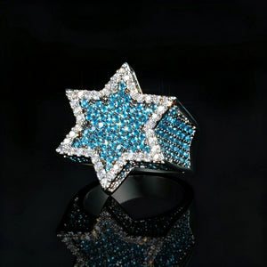 3D iced two‑tone star of david franklin ring for men, hip hop rapper statement jewelry, hand‑set vibrant blue and white aaa cubic zirconia stones, 18k gold plated metal, hexagram star icy bling ring with blue center stones, shot on glossy black reflective background, luxury urban mens fashion ring RDRIP JEWELRY