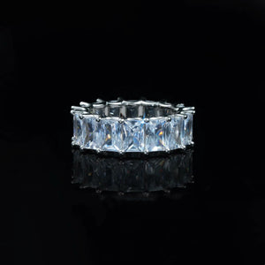 7mm baguette eternity ring 925 silver white gold plated iced out hip hop band, full around rectangular baguette cut cubic zirconia mens ring, silver tone bling statement hiphop jewelry, black reflective studio background RDRIP JEWELRY