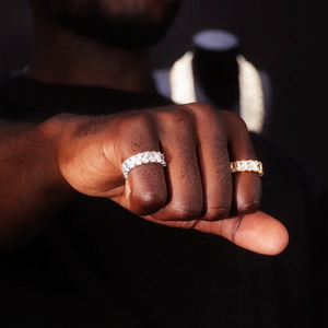 7mm baguette eternity ring 925 silver iced out hip hop band, white gold and gold plated version displayed on mens hand, full baguette cut cubic zirconia ring, real wear lifestyle shot hiphop bling jewelry RDRIP JEWELRY