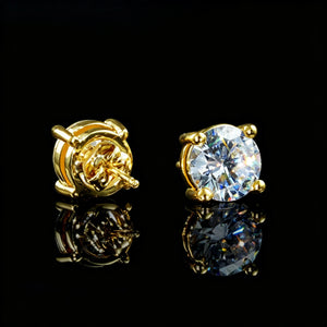 Close-up photo of 8mm Iced Brilliant Cut 4-Prong Gold Stud Earrings, showing stone front and screw back, clear round solitaire studs with reflection, hip hop jewelry RDRIP JEWELRY