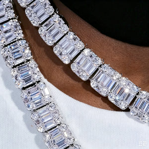 Macro texture close‑up view of 8mm iced baguette cluster tennis chain double layered necklace, hand‑set VVS simulated CZ baguette and round stones showing brilliant sparkle, worn by dark skin Black male model with white crew neck t‑shirt, hip hop bling men unisex icy jewelry detail shot RDRIP JEWELRY