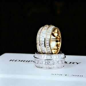 Angle view of stacked Baguette Square Triple Row Ring with gold plated ring placed on top of white gold plated ring,12mm wide men hip hop band rings,hand set flawless VVS simulated baguette and square cut stones full pave heavy icy bling two tone mens statement jewelry RDRIP JEWELRY