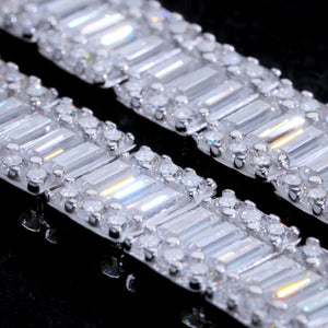 Macro close up detail shot of 8mm wide rectangular baguette cut VVS1+ D color moissanite tennis bracelet for men, solid S925 sterling silver plated with white gold and 18K gold, hand prong set layered baguette and round brilliant moissanite stones showing extreme icy sparkle and fire, tarnish resistant hip hop streetwear wrist stack jewelry, flawless clear moissanite that passes handheld diamond tester, premium men bling bracelet available in 7 inch and 8 inch lengths luxury diamond alternative RDRIP