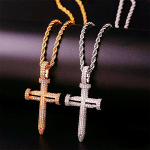Side by side compare view Iced Out Nail Cross Pendant in 18k gold plated and silver tone, full pave AAA cubic zirconia nail crucifix men hip hop necklace matched with rope chain on dark black background RDRIP JEWELRY