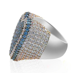 Three‑quarter angled studio shot of icy blue gradient iced out pave love heart ring, heavy thick wide band with highly polished smooth inner shank, densely hand‑set AAA cubic zirconia featuring gradient blue‑grey and clear crystal pave layout, full icy micro pave hip hop statement heart ring, soft reflective mirror effect on clean isolated white background, premium unisex bling rapper streetwear jewelry for men and women RDRIP JEWELRY
