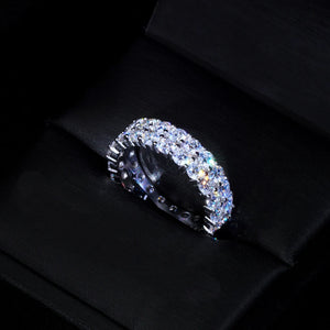 Double row iced out full eternity ring resting inside black luxury gift box, hand‑set D‑Color VVS1+ round 4mm moissanite stones, genuine 925 sterling silver white gold plated hip hop unisex ring, high‑sparkle bling jewelry for men women, RDRIP JEWELRY SINCE 2016