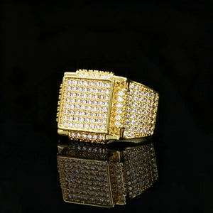 Side angle shot of heavy men full pave square hip hop ring 18k gold plated hand set aaa cubic zirconia stones wide band icy bling rapper statement finger jewelry black reflective background studio product photography RDRIP JEWELRY
