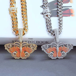 Iced Out Colorful Vintage Butterfly Pendant gold tone and silver tone versions displayed side by side, both matched with full iced cuban link chain, multi‑color micro pave cubic zirconia hip hop bling necklace charm, two finish options studio still life shot for streetwear rapper jewelry RDRIP JEWELRY SINCE 2016