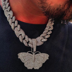 Iced Out Large Vintage Butterfly Pendant real men wear close up shot, fully micro pave AAA cubic zirconia hip hop pendant matched with heavy iced cuban chain, 18k gold plated copper bling street rapper necklace for men RDRIP JEWELRY SINCE 2016
