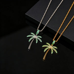 Iced Palm Tree Pendant pair gold and silver finish micro pave green cubic zirconia stones with rope chain displayed on black reflective surface tropical hip hop bling statement necklace for men RDRIP JEWELRY