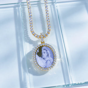 Gold Oval Halo Custom Photo Pendant Necklace with tennis chain, custom printed portrait photo inside oval medallion, laid flat on seamless light clear transparent glass surface, professional studio jewelry photography, RDRIP JEWELRY personalized hip hop memory pendant