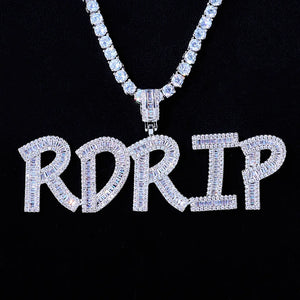 Iced Out Baguette Custom Name Letter Pendant Necklace, white gold tone hanging front view, mixed baguette and round cut stones custom letter pendant spelling RDRIP, matched tennis chain, solid black background, personalized hip hop custom name jewelry, RDRIP JEWELRY