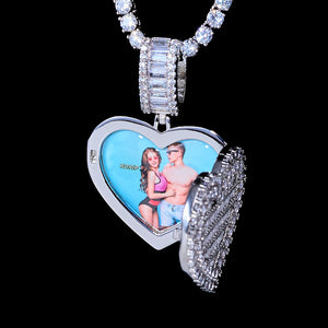 Iced Out Heart Locket Custom Photo Pendant Necklace, white gold tone open heart locket with custom couple portrait photo inside, hanging suspended view paired with tennis chain, solid black background, subtle glass cover reflection, openable personalized hip hop memory keepsake jewelry, RDRIP JEWELRY
