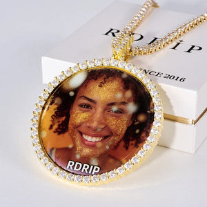 VVS MOISSANITE LARGE 3D CIRCLE CUSTOM PICTURE PENDANT, gold tone personalized portrait photo medallion hip hop necklace with tennis chain, displayed on official RDRIP white gift jewelry box, light white surface background, RDRIP JEWELRY