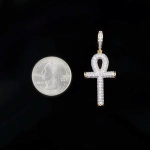 Size comparison shot two tone gold silver fully iced out Ankh cross pendant next to US quarter coin, VVS moissanite Egyptian life symbol hip hop charm pendant necklace showing real dimension RDRIP JEWELRY