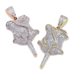 Side by side comparison of two iced out bling fully paved rose flower pendants, gold tone and rose gold tone finish covered with flawless vvs simulated diamonds, closeup view of hip hop rose charm pendants for unisex streetwear RDRIP JEWELRY SINCE 2016
