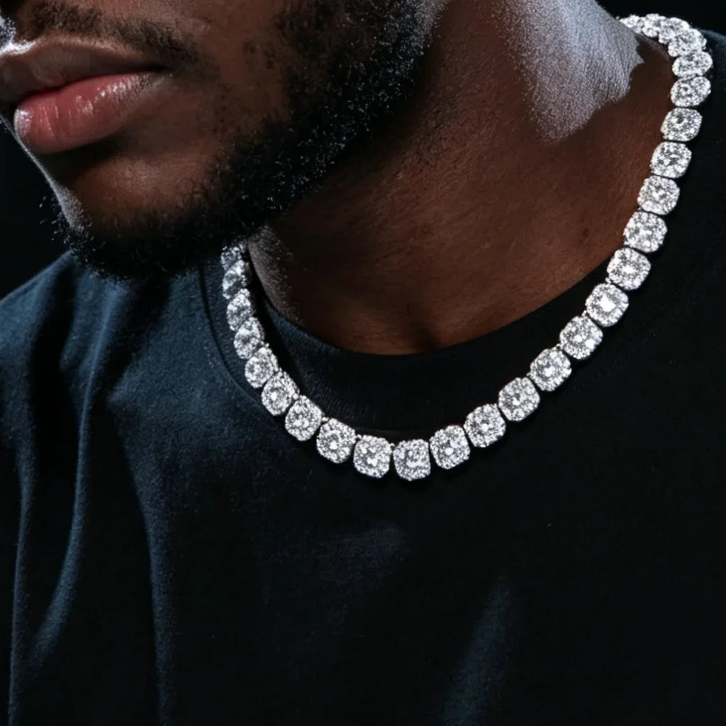10MM Cushion Clustered Tennis Chain in White Gold worn on male model, men hip‑hop portrait studio shot on dark black background, fully iced cushion cluster simulated diamond tennis necklace, unisex icy bling statement jewelry for men, showing real wear effect, premium rap style neck chain RDRIP JEWELRY
