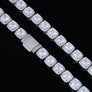 Close‑up detail shot of 10MM Glacier Cushion Clustered Tennis Chain in White Gold, fully iced pave lock clasp mechanism, hand‑set VVS flawless simulated cushion diamonds with clustered halo setting, heavy duty hip hop tennis chain hardware and stone facets on solid black studio background RDRIP JEWELRY
