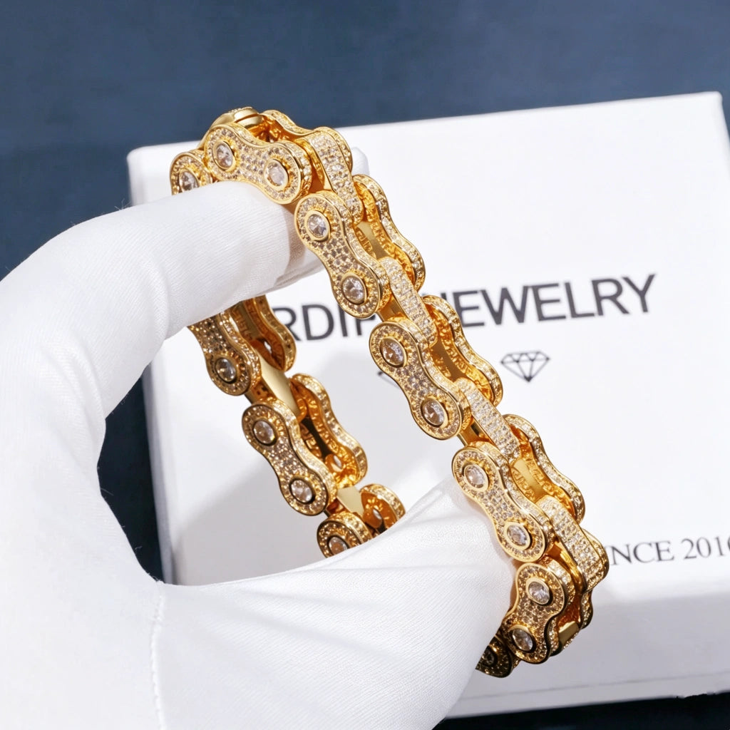 11mm Iced Out Bike Chain Link Bracelet for men, hand‑set VVS simulated diamond stones with no‑glue craftsmanship, 18K gold plated hip hop bling drip jewelry, fully iced bike chain wrist bracelet held by white inspection glove, branded gift box in background, premium icy hiphop fashion accessory RDRIP JEWELRY
