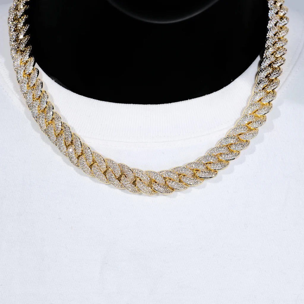 Front closeup studio photo of 14mm 3 row bubble dense fully paved iced miami cuban link chain 18k gold plated fully hand prong set flawless VVS simulated diamond heavy chunky hip hop men necklace displayed on black bust mannequin paired with plain white crew neck tee soft studio lighting ultra clear shiny stone details full encrusted bling rapper streetwear jewelry showcase RDRIP JEWELRY
