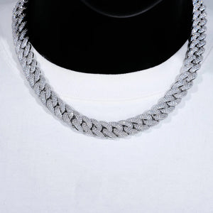 Close up studio shot of 14mm 3 row bubble dense fully paved iced miami cuban link chain white gold plated fully hand prong set flawless VVS simulated diamond heavy chunky hip hop mens necklace displayed on black bust mannequin with plain white crew neck tee soft lighting ultra clear shiny stone details full stone encrusted clasp bling streetwear rapper jewelry product showcase RDRIP JEWELRY
