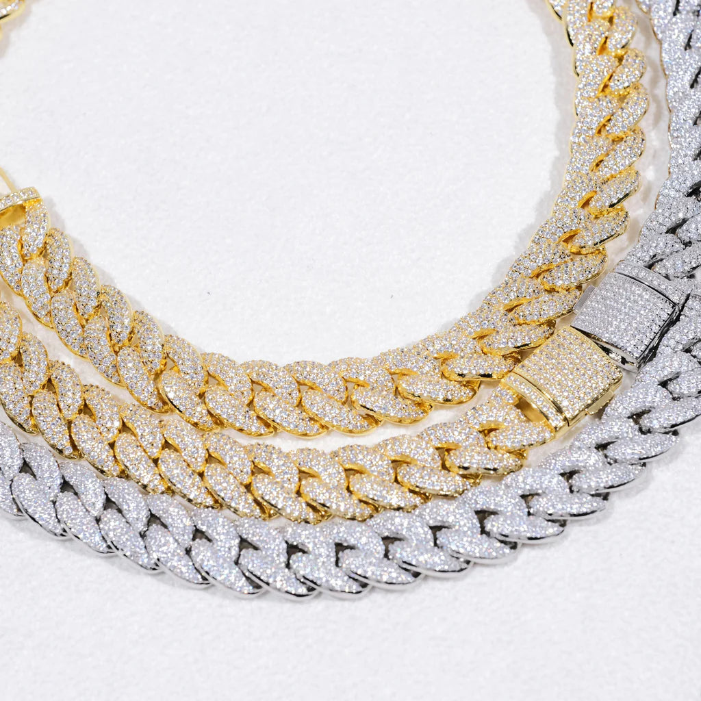 Close up flat lay product photo of layered stack two 14mm 3 row bubble dense fully paved iced miami cuban link chains 18k gold plated and white gold plated fully hand prong set flawless VVS simulated diamonds heavy chunky hip hop men necklace fully encrusted diamond side lock clasp bright clear stone micro detail soft white background high resolution bling rapper streetwear jewelry showcase RDRIP JEWELRY
