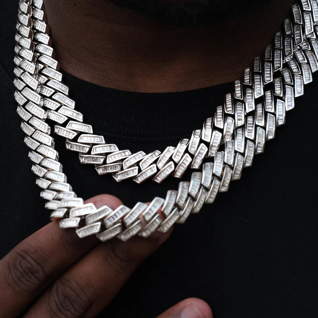 14MM Baguette Channel‑Set Miami Cuban Link Necklace,18K white gold plated iced‑out men hip hop chain,hand‑set flawless VVS simulated baguette stones,two‑layer stacked necklace on deep skin tone model,hand gently touching cuban chain links to showcase stone details,black crew neck top background,high‑end bling rapper streetwear statement jewelry RDRIP JEWELRY
