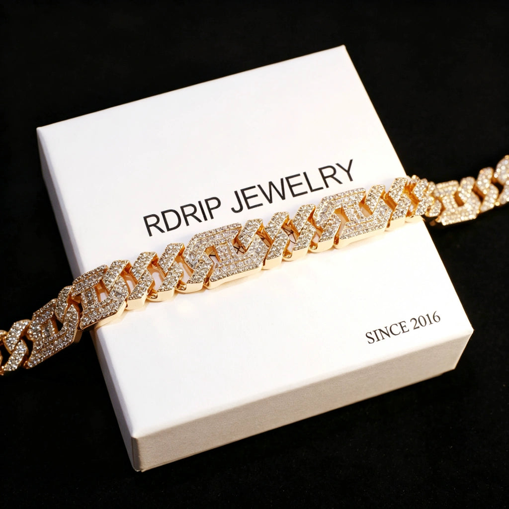 Close‑up shot of 14mm gold plated iced out geometric polygon cuban link bracelet for men, hollow multi‑sided links fully prong‑set with flawless VVS simulated CZ diamonds, micro pave icy hip hop rapper jewelry, displayed on branded RDRIP JEWELRY card marked SINCE 2016 against black background, premium baller‑style men’s street‑wear bling wrist bracelet RDRIP JEWELRY
