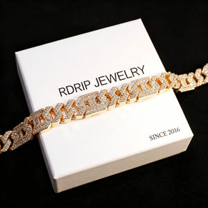 Close‑up shot of 14mm gold plated iced out geometric polygon cuban link bracelet for men, hollow multi‑sided links fully prong‑set with flawless VVS simulated CZ diamonds, micro pave icy hip hop rapper jewelry, displayed on branded RDRIP JEWELRY card marked SINCE 2016 against black background, premium baller‑style men’s street‑wear bling wrist bracelet RDRIP JEWELRY
