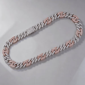 Flat lay overhead view of 14mm iced prong two‑tone cuban choker link necklace with full iced clasp, white and pink two‑tone hip hop chain, hand‑set flawless VVS simulated diamonds, heavy solid pure copper base with 18K gold plated finish, premium bling icy streetwear statement jewelry for men RDRIP JEWELRY
