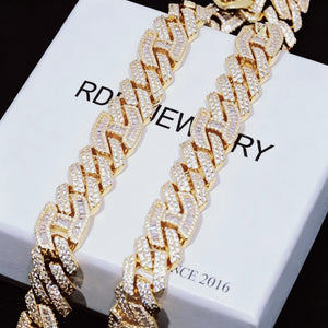 Close‑up shot of 15mm prong‑set mixed‑stone iced cuban curb chain resting on branded jewelry box RDRIP JEWELRY SINCE 2016, 18K gold plated pure copper men hip hop necklace, hand‑set baguette cut and round VVS simulated diamonds, full iced out heavy streetwear jewelry detail shot RDRIP JEWELRY
