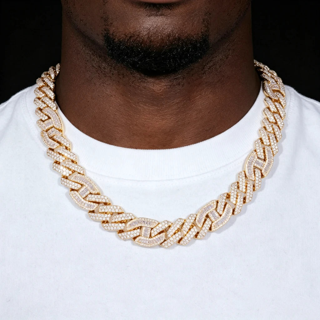 15mm prong set mixed‑stone iced cuban curb chain worn by black man with light beard, 18K gold plated pure copper hip hop necklace, baguette and round VVS simulated diamonds full iced out men streetwear jewelry RDRIP JEWELRY

