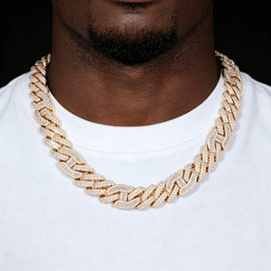 15mm prong set mixed‑stone iced cuban curb chain worn by black man with light beard, 18K gold plated pure copper hip hop necklace, baguette and round VVS simulated diamonds full iced out men streetwear jewelry RDRIP JEWELRY
