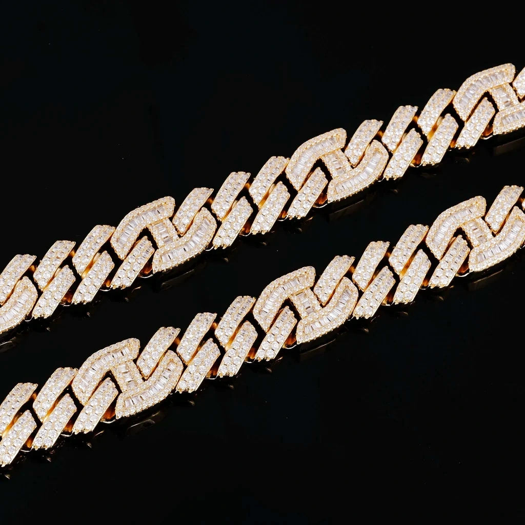 Macro close‑up texture shot of two 15mm prong‑set mixed‑stone iced cuban curb chains, hand prong‑set baguette cut and round VVS simulated diamonds, 18K gold plated pure copper hip hop jewelry links, full iced‑out detailed view of stone inlay and prong craftsmanship against solid black background, premium men streetwear bling necklace detail RDRIP JEWELRY
