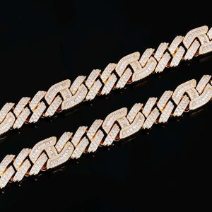 Macro close‑up texture shot of two 15mm prong‑set mixed‑stone iced cuban curb chains, hand prong‑set baguette cut and round VVS simulated diamonds, 18K gold plated pure copper hip hop jewelry links, full iced‑out detailed view of stone inlay and prong craftsmanship against solid black background, premium men streetwear bling necklace detail RDRIP JEWELRY
