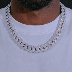 Front close‑up shot of 16MM Rect Baguette Cuban Link Chain worn on dark skin black man with light goatee beard, iced‑out mixed rectangular baguette cut and round flawless VVS simulated diamonds men's miami cuban necklace, white gold plated heavy hip hop bling rapper jewelry, sharp crystal sparkle detail against solid black background, RDRIP JEWELRY
