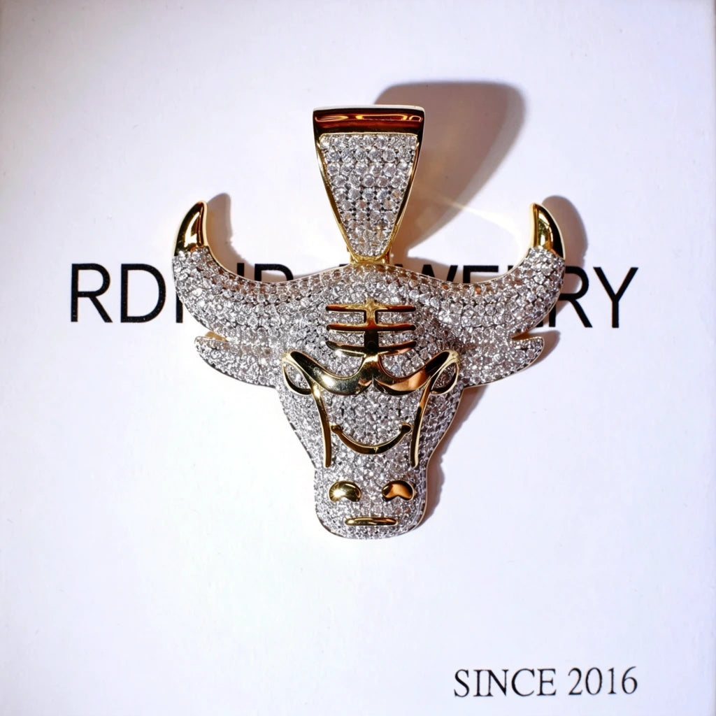 Two tone 18k gold plated iced out micro paved bull head pendant for men, front facing ox head charm full of sparkling cubic zirconia stones, hip hop icy street jewelry, bold bull design mens necklace pendant RDRIP JEWELRY SINCE 2016
