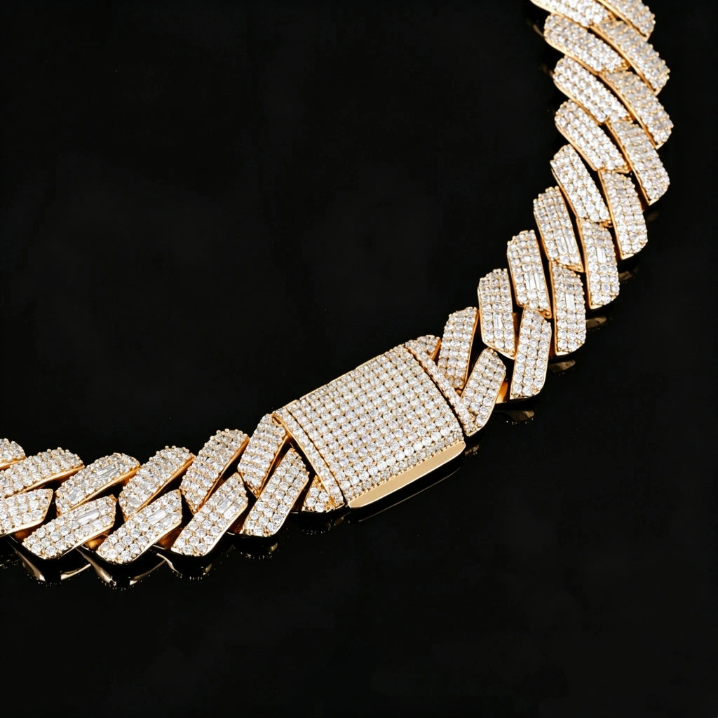 Extreme close-up studio product shot of 19mm full iced out prong set rectangular baguette cuban link chain in polished 18K gold plating, heavy men hip hop bling necklace with flawless VVS simulated diamond stones, ultra detailed fully micro pave diamond encrusted box clasp, laid on glossy black reflective mirror surface with natural soft mirror reflection, solid copper base hand-set stone streetwear statement jewelry close up detail photo RDRIP JEWELRY
