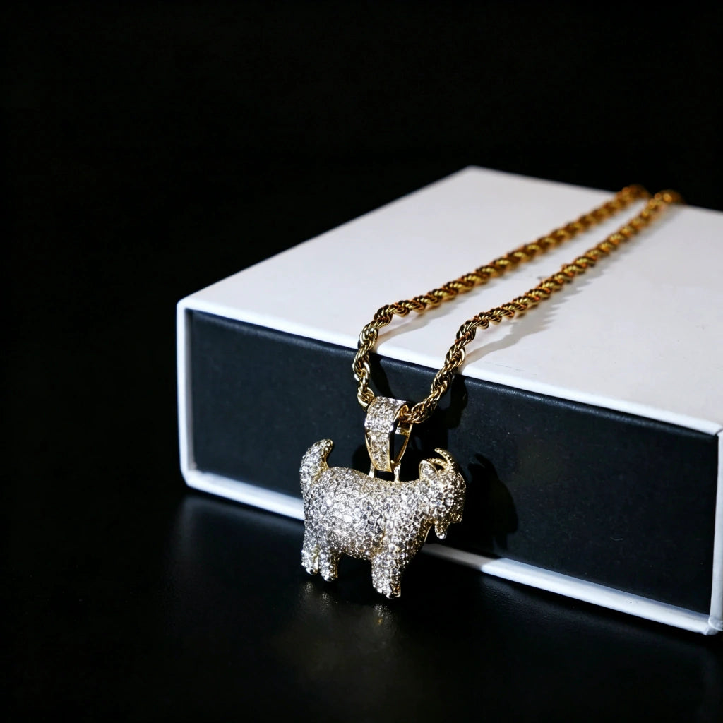 29mm Full Micro Paved Iced‑Out GOAT Pendant laid over luxury gift box packaging, fully micro paved VVS simulated diamond goat hip hop charm paired with 18k gold rope chain, premium street rapper jewelry unboxing scene, RDRIP JEWELRY SINCE 2016
