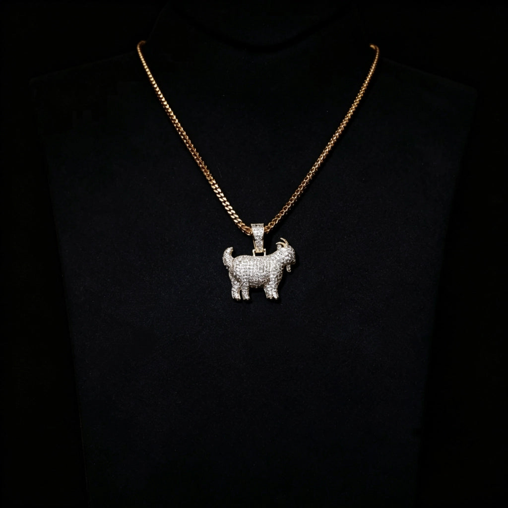 29mm Full Micro Paved Iced‑Out GOAT Pendant displayed on black jewelry bust, fully micro paved vvs simulated diamond goat hip hop necklace, 18k gold plated cuban chain, iconic greatest of all time street rapper jewelry, RDRIP JEWELRY SINCE 2016
