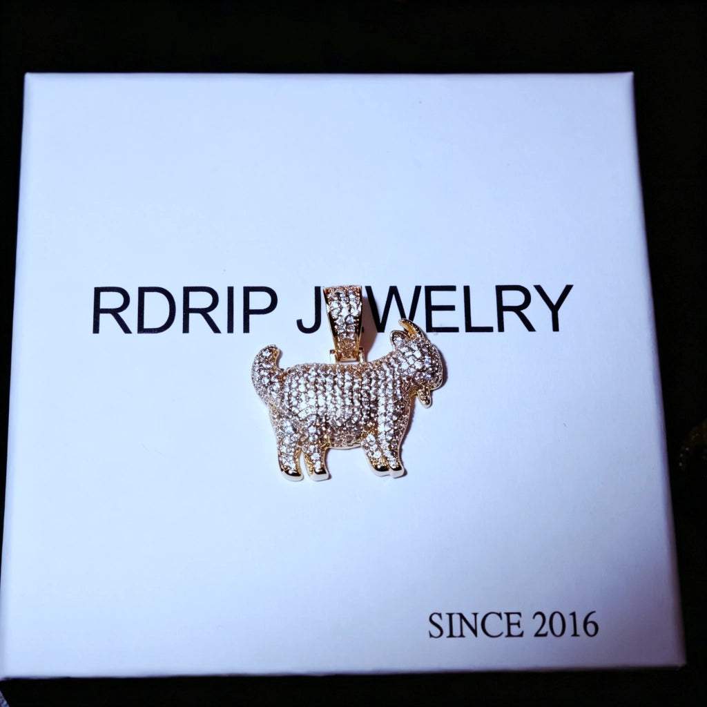 29mm Full Micro Paved Iced‑Out GOAT Pendant laid flat on official RDRIP JEWELRY branded gift box, fully micro paved VVS simulated diamond goat hip hop charm, top down overhead shot of premium street culture jewelry, RDRIP JEWELRY SINCE 2016
