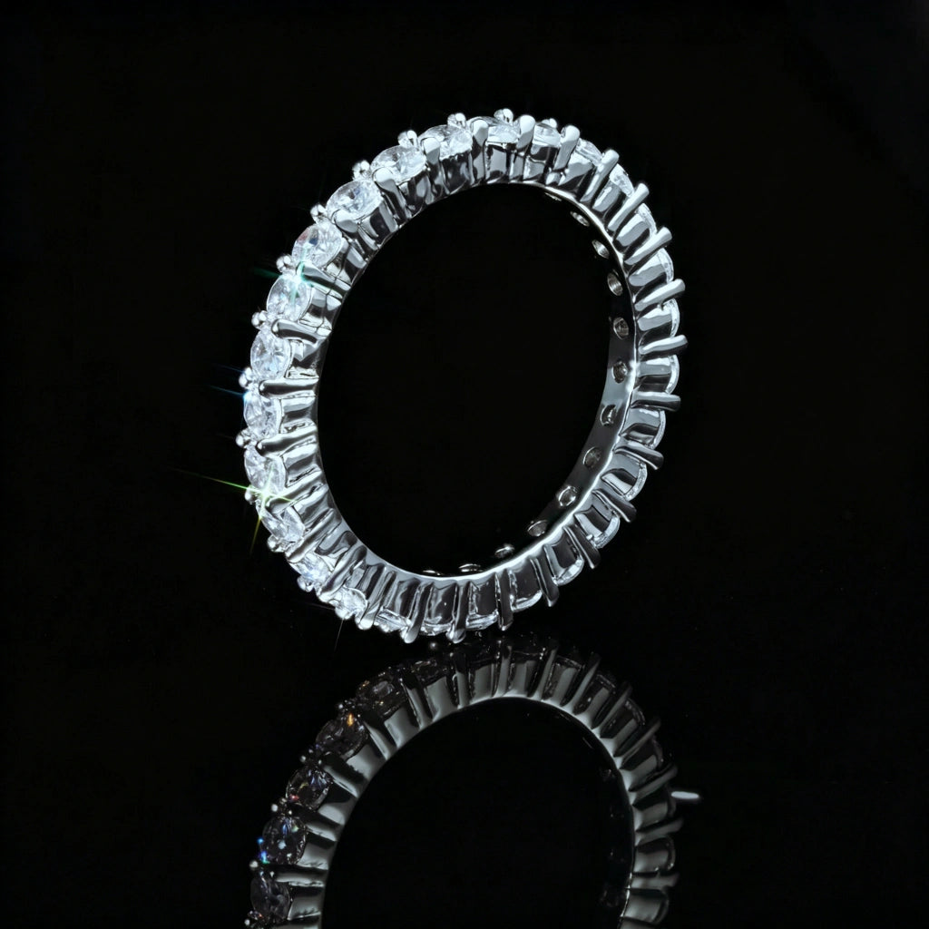 2mm ripple micro pave iced stacking band ring, side angle close‑up studio photo, showing prong ripple setting details of cubic zirconia stones, reflective black background with mirror reflection, icy hip hop fine jewelry RDRIP JEWELRY
