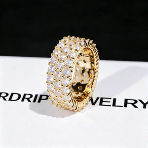 3‑Row Fully Paved Iced Out Eternity Ring single 18K gold plated close‑up photograph on RDRIP JEWELRY branded card, 8mm width full wrap hip hop eternity band ring, hand‑set 4MM flawless VVS CZ simulated diamonds, heavy micro pave icy bling hip‑hop statement ring for men and women, brilliant sparkling full paved simulated diamond ring detail shot RDRIP JEWELRY SINCE 2016