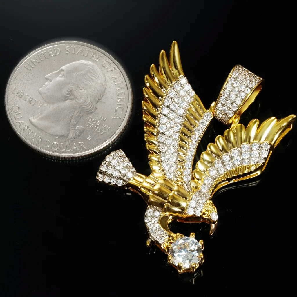 33mm Iced Victory Eagle Pendant gold plated cubic zirconia hip hop charm size comparison with US quarter coin showing real dimensions spread wing eagle clutching big round stone men hiphop rapper pendant reference scale RDRIP JEWELRY
