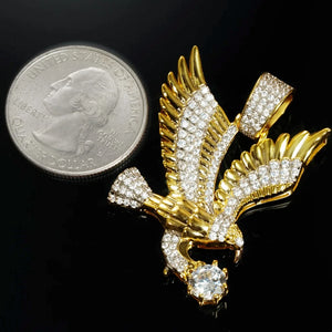 33mm Iced Victory Eagle Pendant gold plated cubic zirconia hip hop charm size comparison with US quarter coin showing real dimensions spread wing eagle clutching big round stone men hiphop rapper pendant reference scale RDRIP JEWELRY
